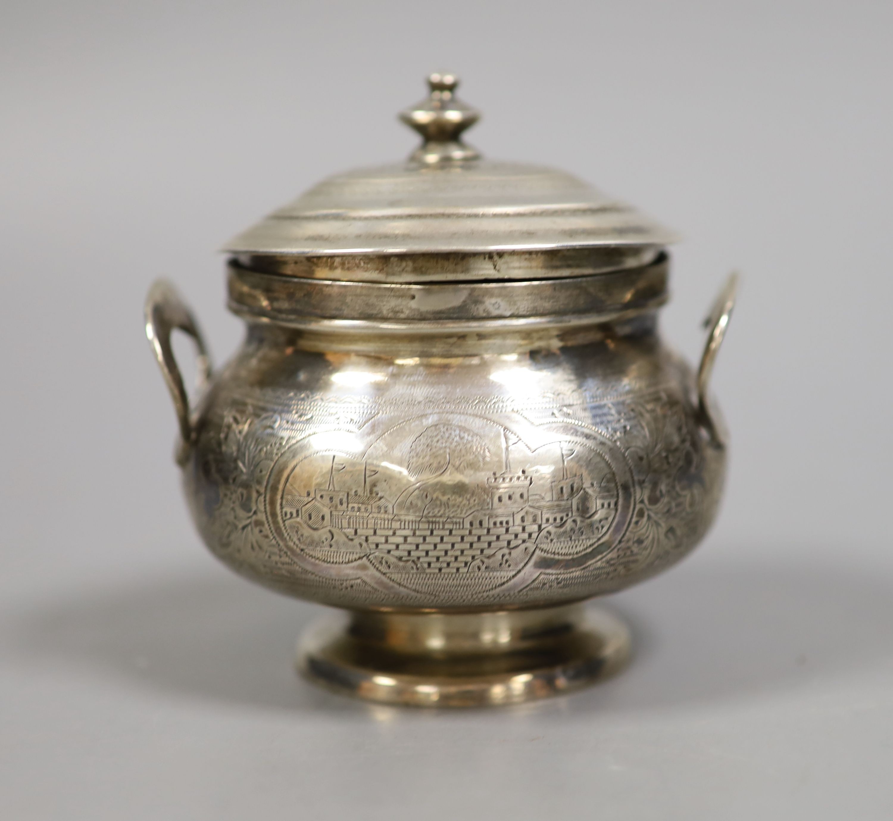 A late 19th century Russian 84 zolotnik engraved two handled pot and cover, assay master B.C, dated 1873, height 10cm, 7oz.